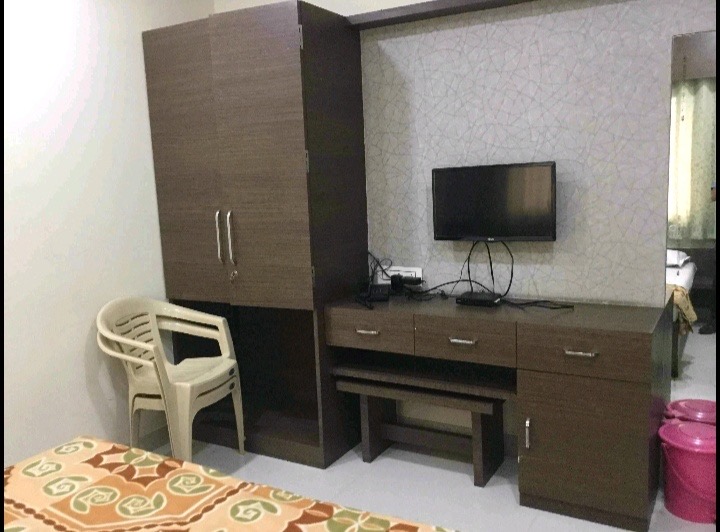 Clean, comfortable guest room at LTC Hotel