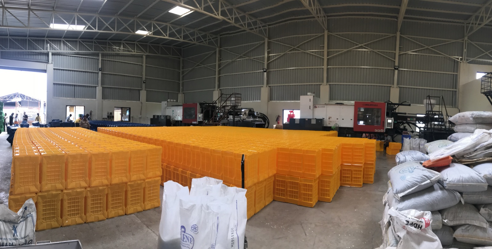 LTC Industries factory floor with injection moulding machines and stacked crates