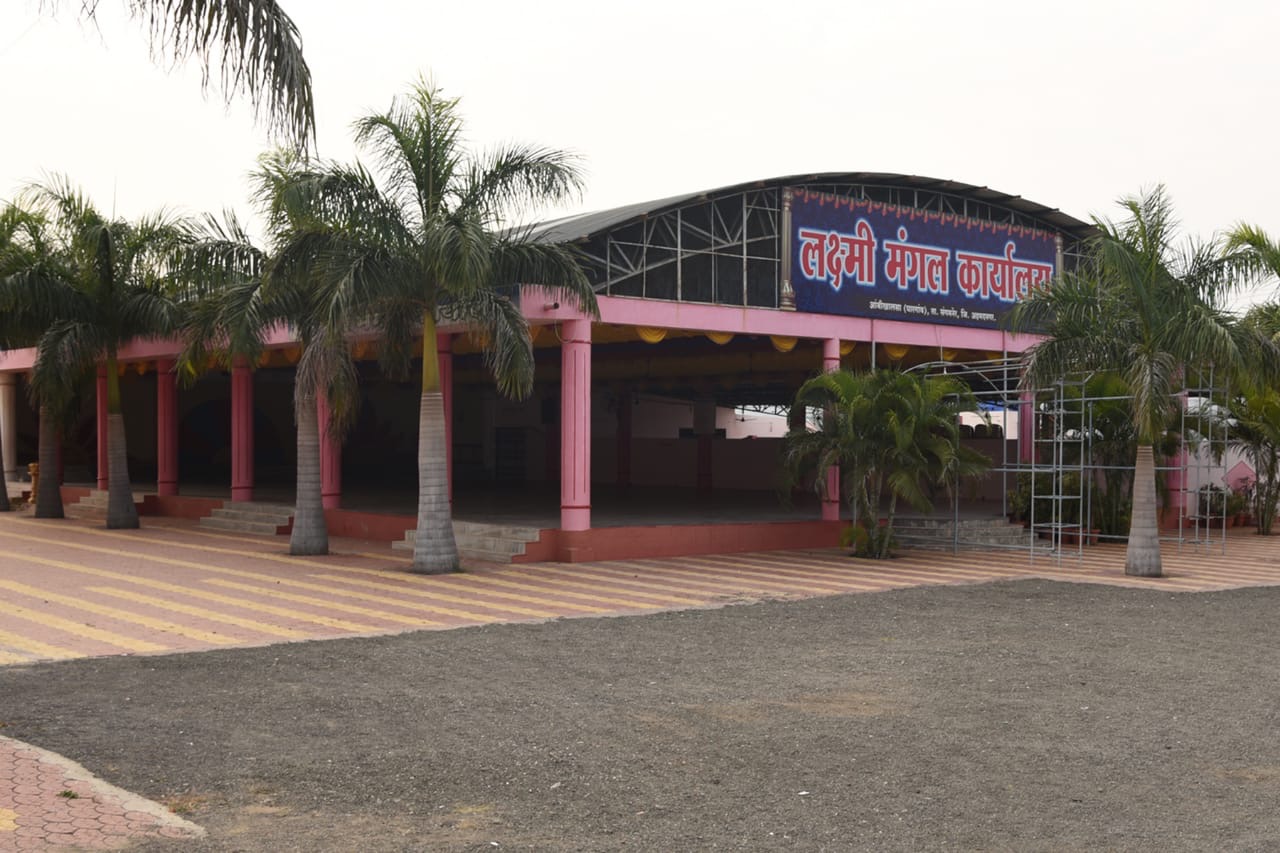 Laxmi Mangal Karyalaya marriage hall with palm-lined entrance